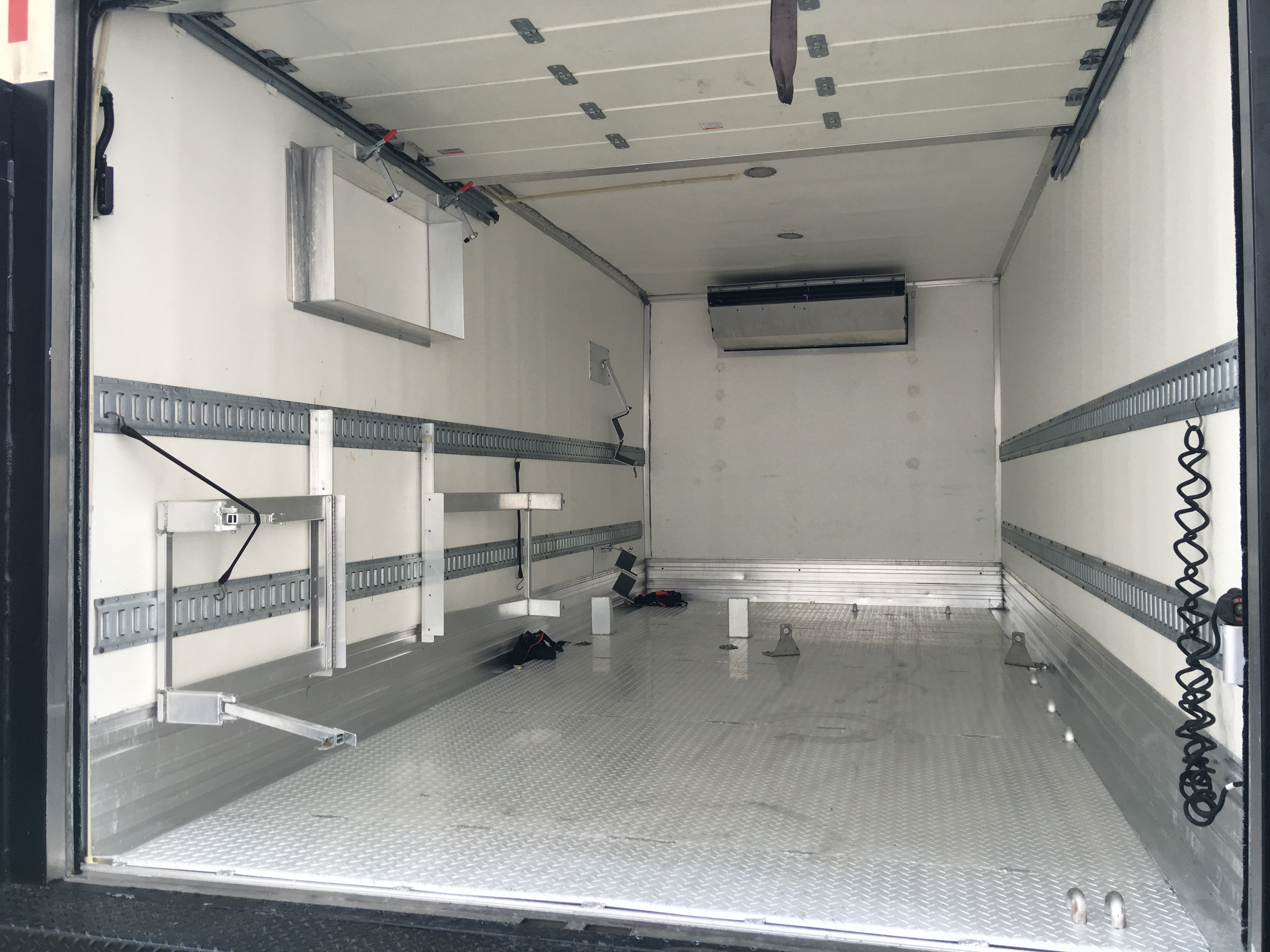 Interior of custom truck body with mounting hardware