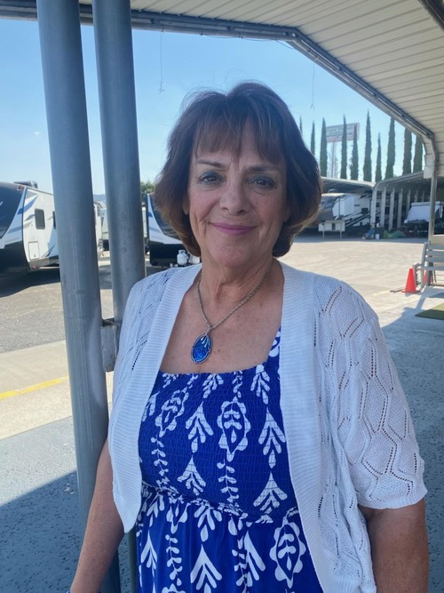 A smiling member of the Banning Discount RVs family on the lot