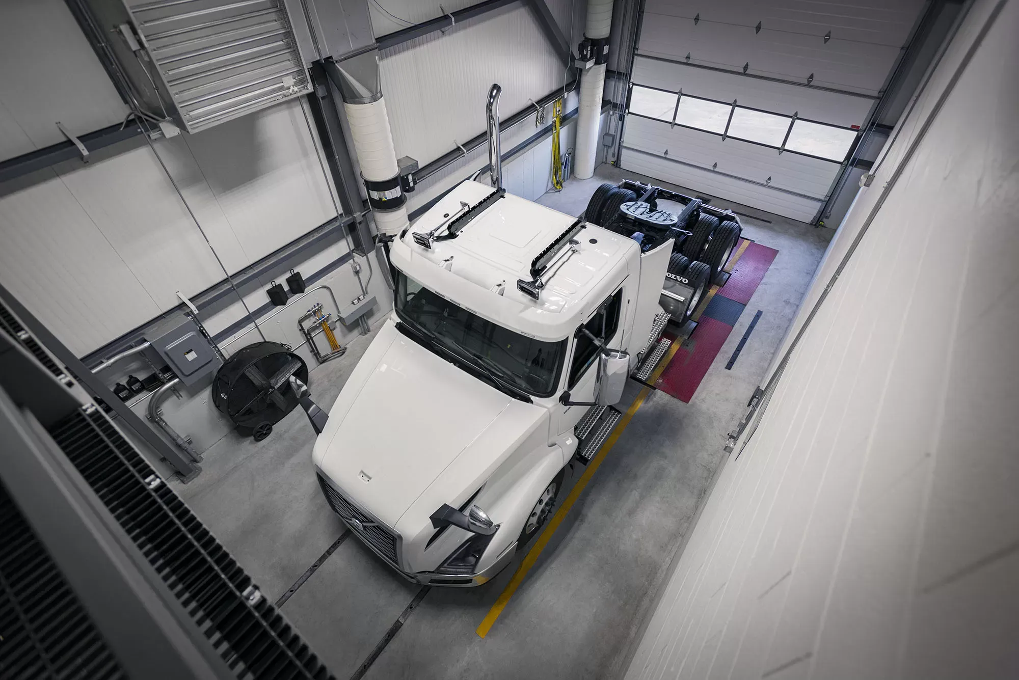 Truck positioned in dynamometer service bay