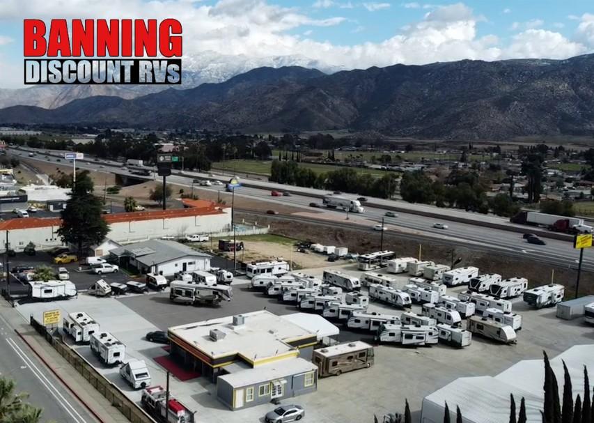 Aerial view of the Banning Discount RVs lot on W Ramsey St, just off Interstate 10 with the mountains behind
