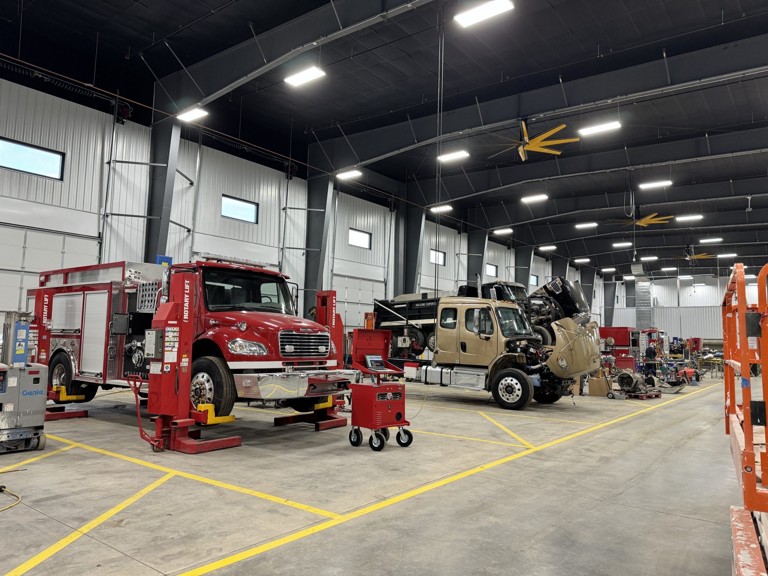 Crane truck in service bay